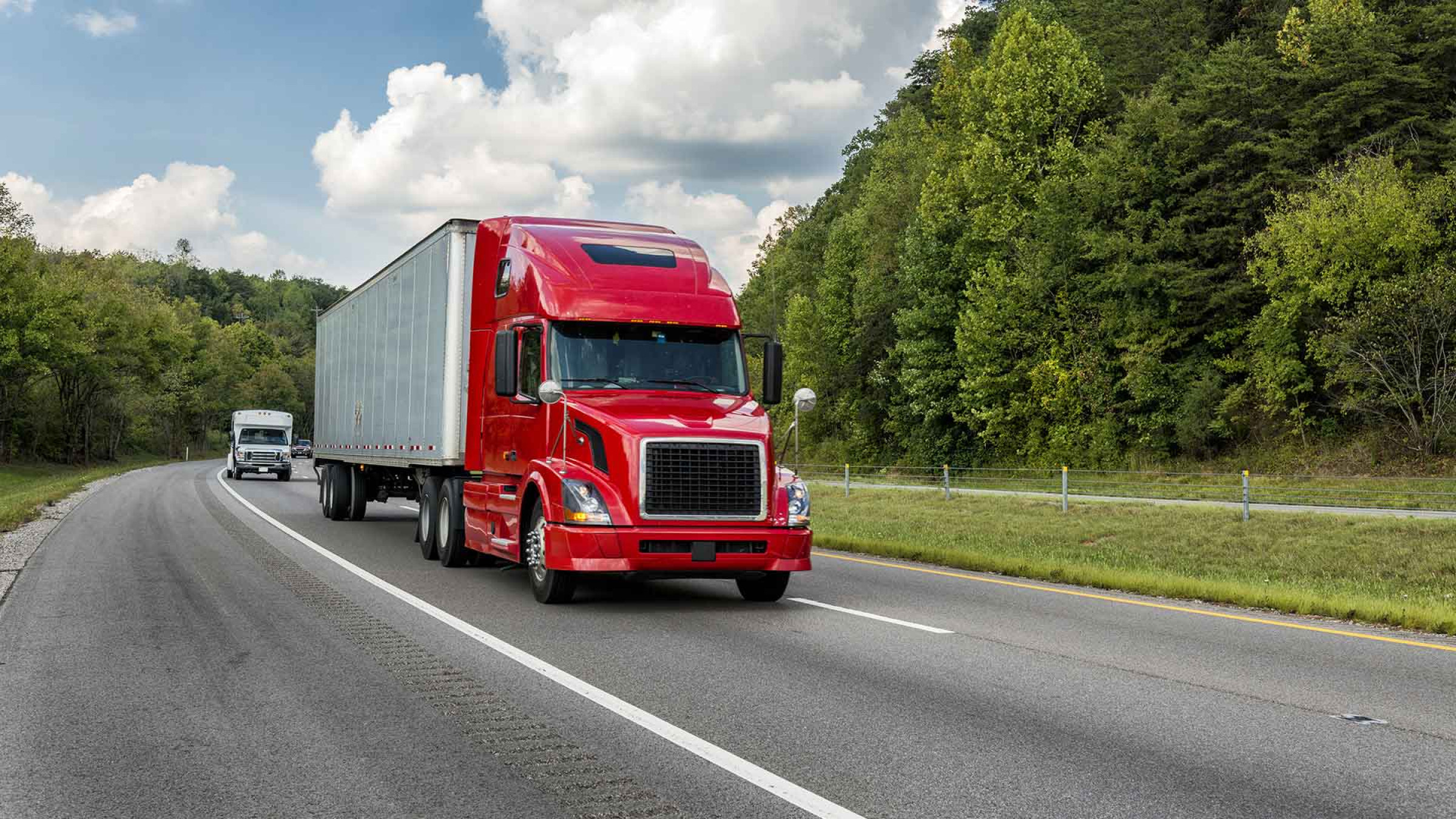 red semi-truck on the highway