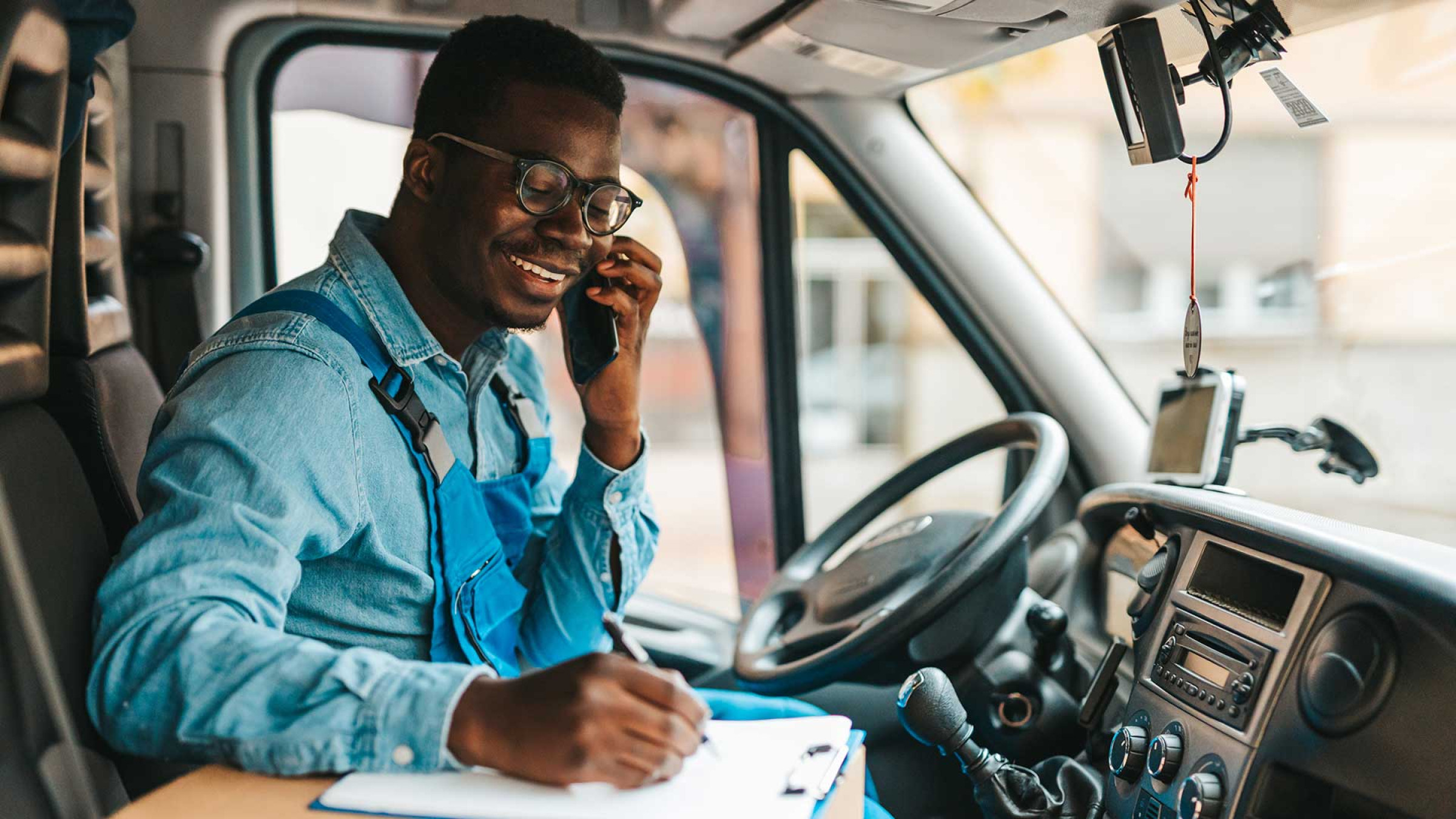 Truck Driver With Phone And Clipboard